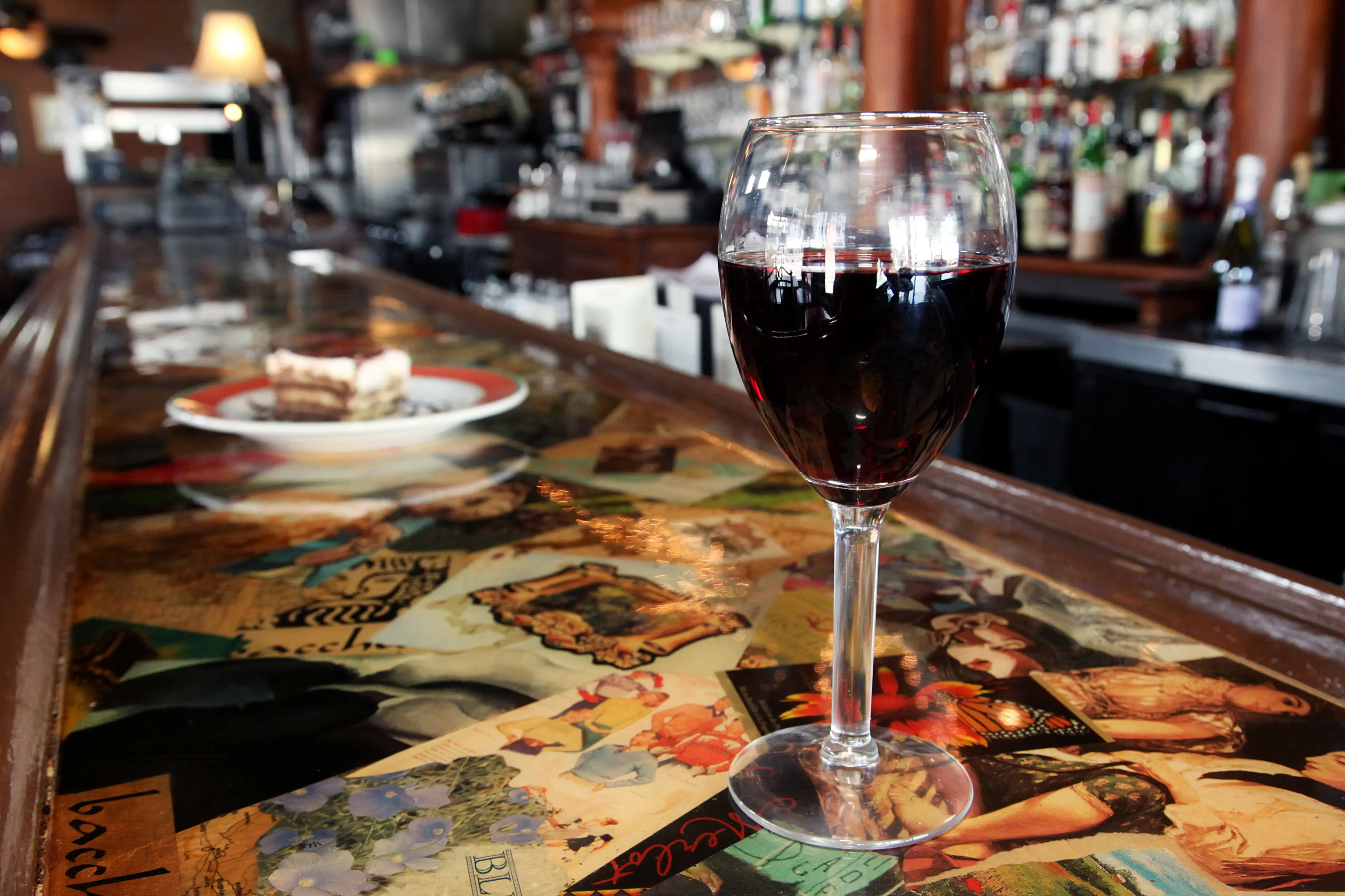 A glass of wine on the bar at Bacchus in Richmond's Fan District